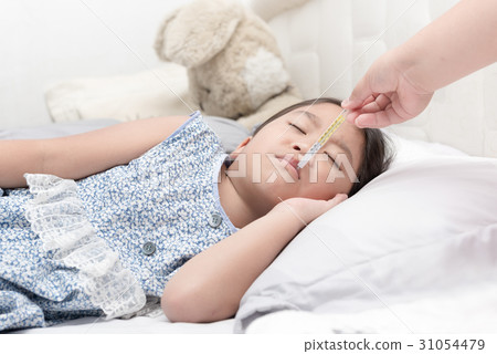 Mother measuring temperature of her ill kid Mother measuring temperature of her ill kid 31054479
