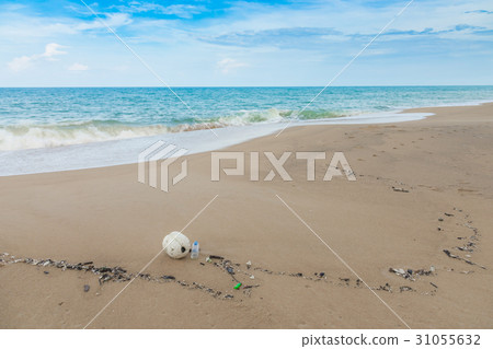 Plastic bottles and other waste on sea beach . Plastic bottles and other waste on sea beach . 31055632