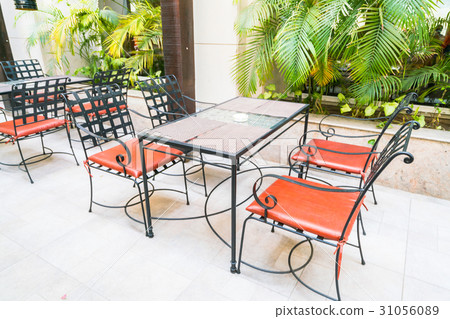 Tables and chairs in restaurant . Tables and chairs in restaurant . 31056089