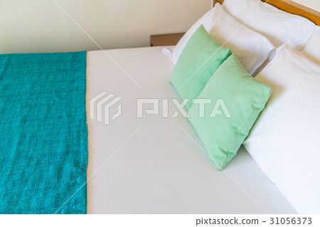 Comfortable pillows and bed . 31056373