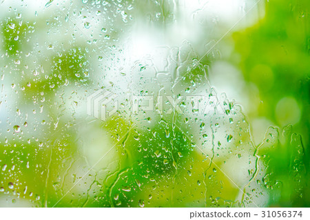 Water drops on green background . Water drops on green background . 31056374