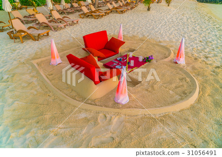 Dining table on beach at tropical Maldives island Dining table on beach at tropical Maldives island 31056491