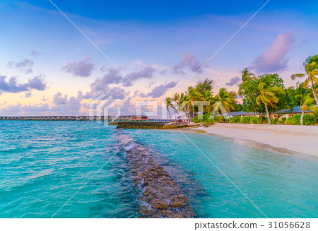 Beautiful sunset with sky over calm sea in tropical Maldives island . 31056628