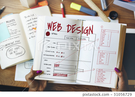 Hands working on notebook network graphic overlay Hands working on notebook network graphic overlay 31056729