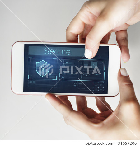 Hands working on digital device network graphic overlay 31057200