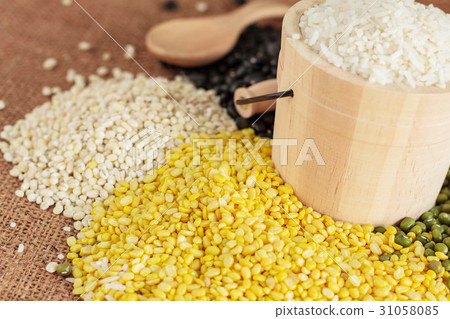 beans and rice on sackcloth. beans and rice on sackcloth. 31058085