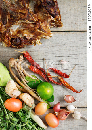 Dried fish and spices on wooden. 31058089