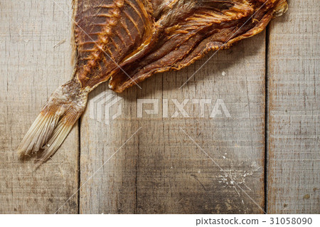 Dried fish on wooden. Dried fish on wooden. 31058090