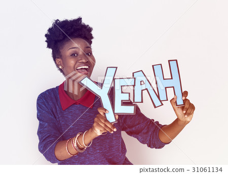 Smiling African Woman Holding Yeah Word Smiling African Woman Holding Yeah Word 31061134