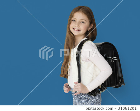 Young freckled girl carrying a backpack smiling portrait Young freckled girl carrying a backpack smiling portrait 31061201