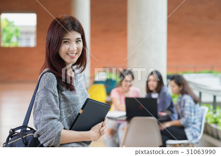 Cute asian college student at campus university. Cute asian college student at campus university. 31063990