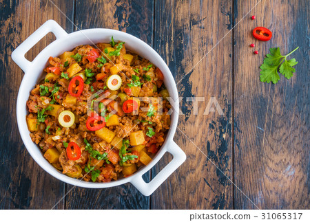 Picadillo, a stew of ground beef and tomatoes Picadillo, a stew of ground beef and tomatoes 31065317