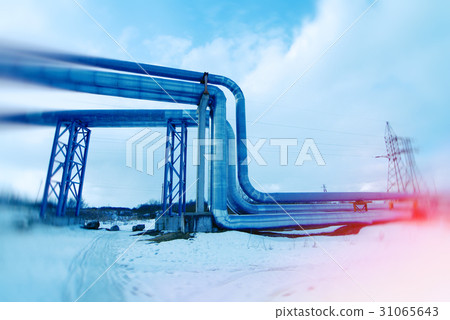 Steel pipelines and valves against blue sky. to 31065643