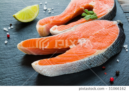 Two big raw salmon steaks, fresh lime Two big raw salmon steaks, fresh lime 31066162