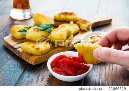 Portion of crisp chicken nuggets Portion of crisp chicken nuggets 31066229