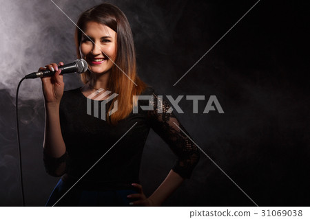 Singer on background of smoke Singer on background of smoke 31069038