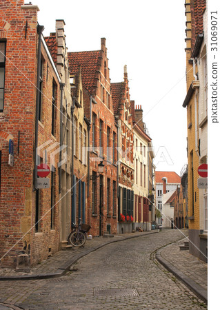 Street with medieval buildings, Bruges, Belgium 31069071