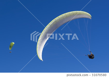 Paragliding in blue sky 31070580
