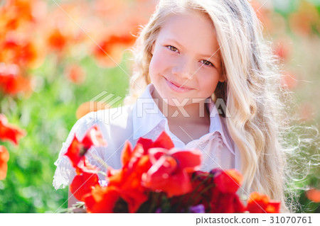 Cute blonde child girl with bouquet of poppies Cute blonde child girl with bouquet of poppies 31070761
