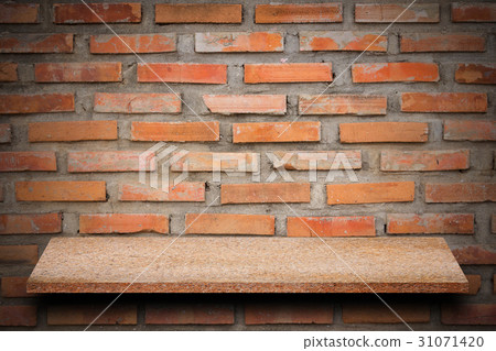 Empty top of natural stone shelves and stone wall 31071420