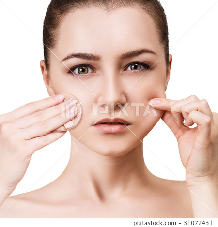 Young woman using cosmetics sponge. 31072431