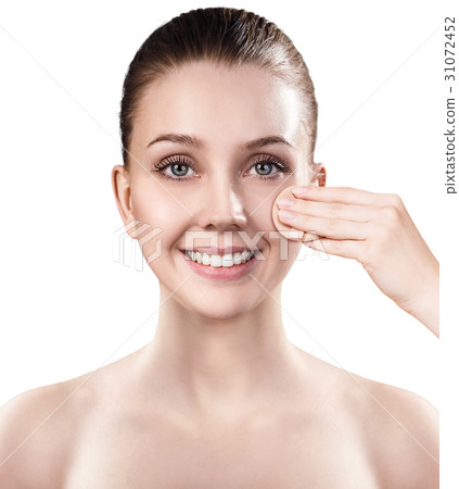 Young woman using cosmetics sponge. 31072452