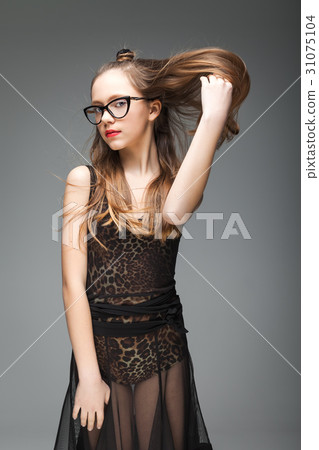 Younf brunette girl with glasses 31075104