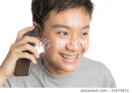 Young man smiling and happy use smartphone.  31075651