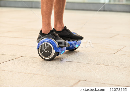Legs on hoverboard. Legs on hoverboard. 31078365