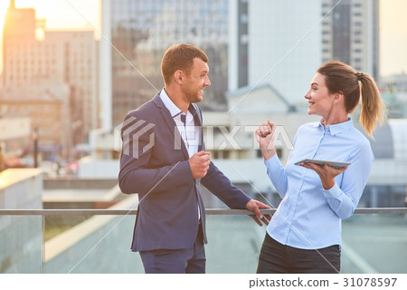Happy business couple with tablet. Happy business couple with tablet. 31078597