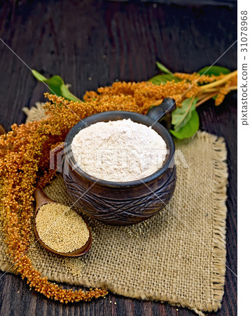 Flour amaranth in clay cup with flower on board Flour amaranth in clay cup with flower on board 31078968
