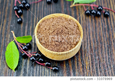 Flour bird cherry in bowl with berries Flour bird cherry in bowl with berries 31078969