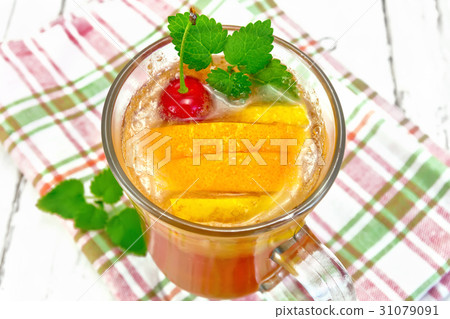 Lemonade with cherry and orange in wineglass 31079091