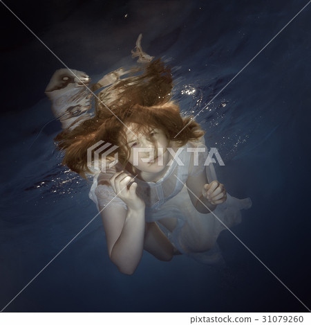 Portrait of a young girl under the water Portrait of a young girl under the water 31079260