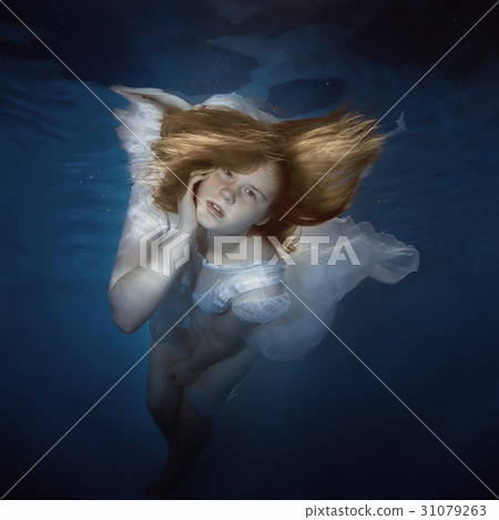 Portrait of a young girl under the water Portrait of a young girl under the water 31079263