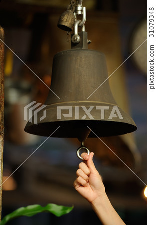 hand with a bell 31079348