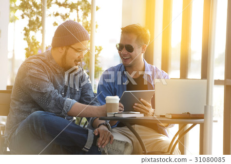 Young man working on laptop 31080085