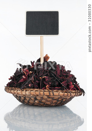 Plate with a bunch of hibiscus petal and price tag 31080330