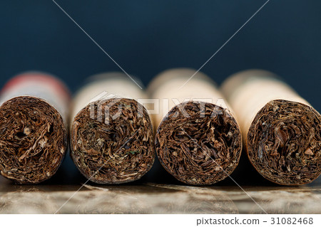 Close-up of Cuban cigars on brown marble. Macro 31082468