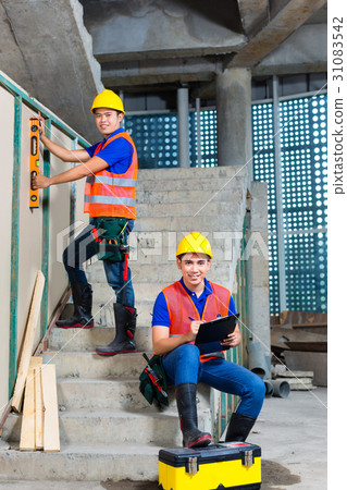 workers on building or construction site walling workers on building or construction site walling 31083542