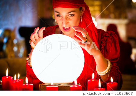 Fortuneteller at Seance with Crystal ball 31083607