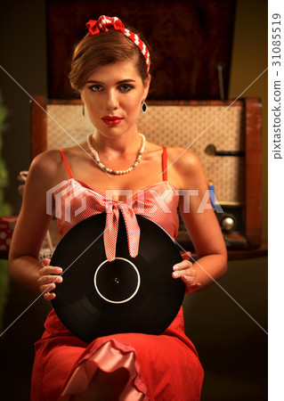 Retro woman with music vinyl record. Girl pin-up Retro woman with music vinyl record. Girl pin-up 31085519