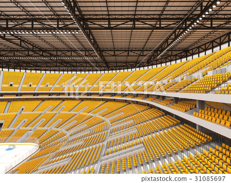 Large modern ice hockey arena with yellow seats 31085697