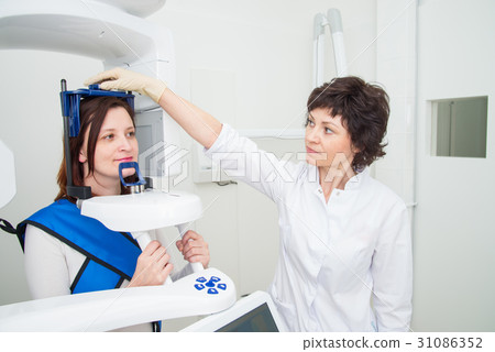 Dentist taking a panoramic digital X-ray of a 31086352
