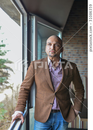Portrait of happy handsome indian business man 31086359