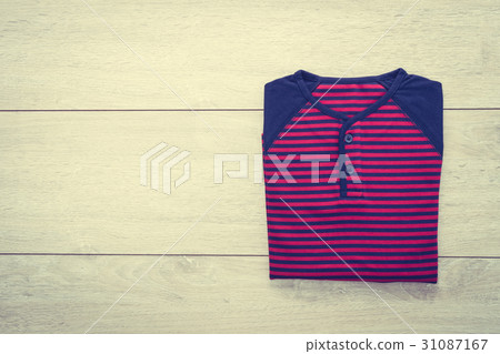 Shirt on wooden background 31087167