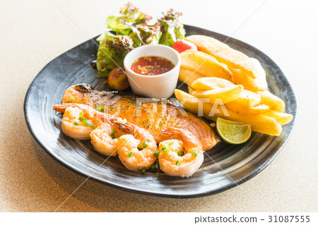Grilled salmon and prawn steak Grilled salmon and prawn steak 31087555