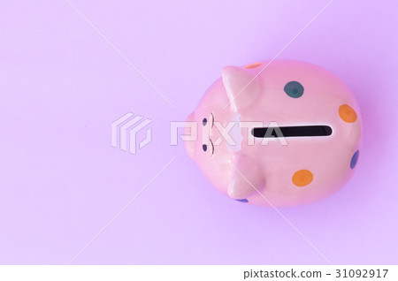 Closeup top view pink ceramic piggy bank on pink 31092917