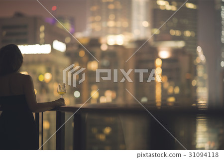 woman on the balcony Kuala Lumpur night city woman on the balcony Kuala Lumpur night city 31094118