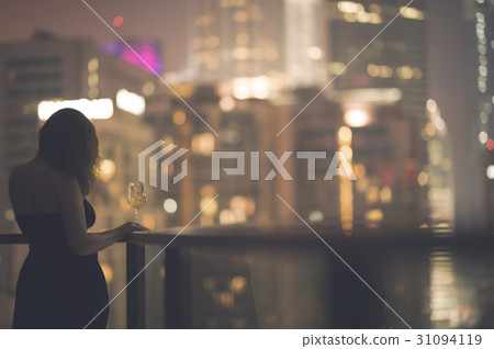 woman on the balcony Kuala Lumpur night city woman on the balcony Kuala Lumpur night city 31094119
